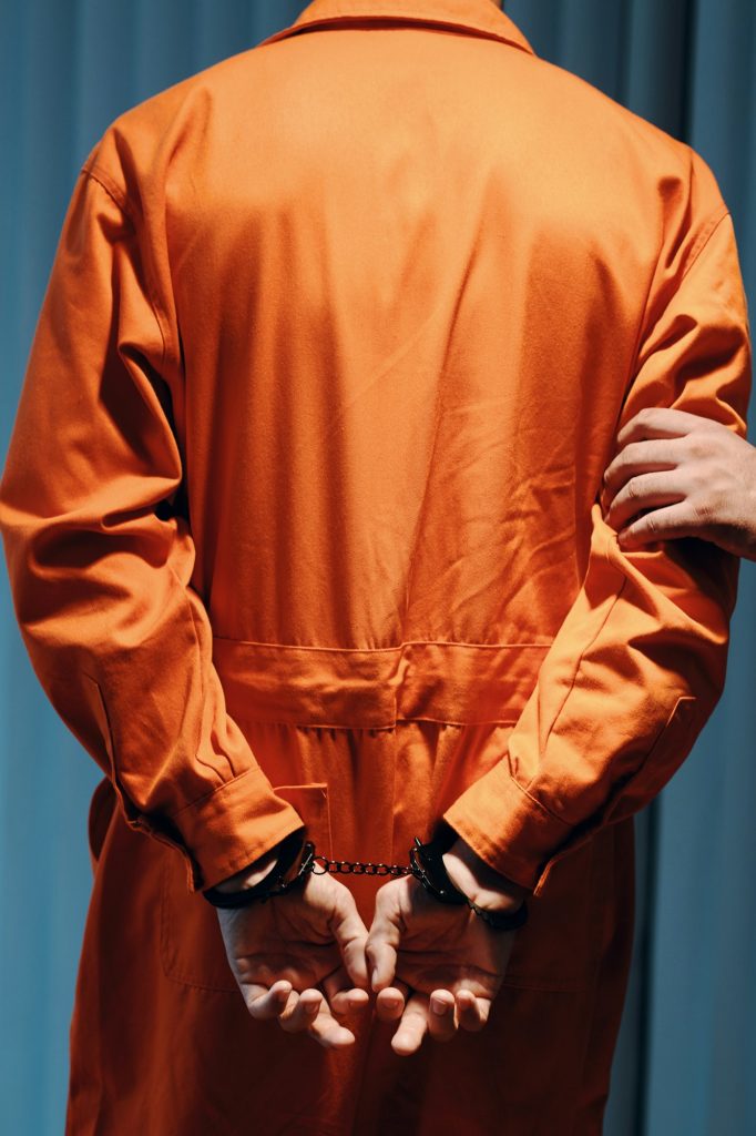 Officer Walking Criminal to Jail